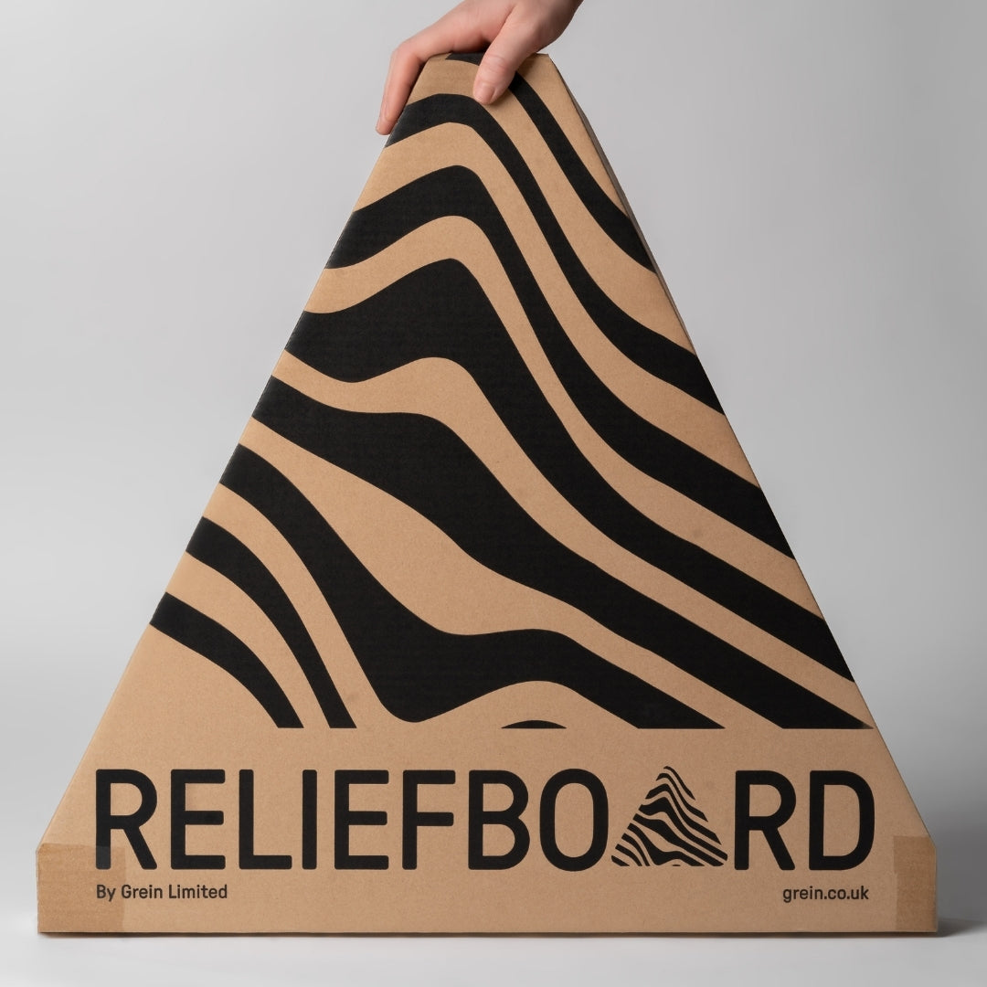 Triangular Reliefboard box with the company logo pattern printied on it being held by a hand against a gray background